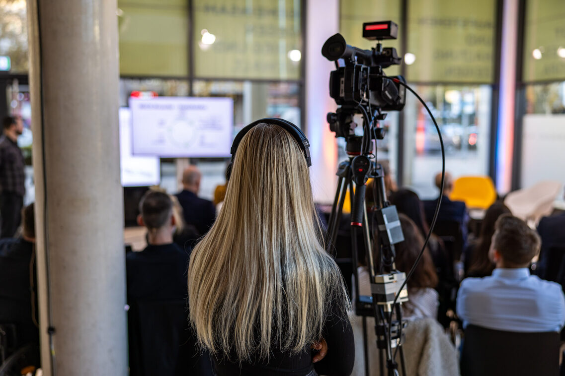 Camera team behind the event visitors